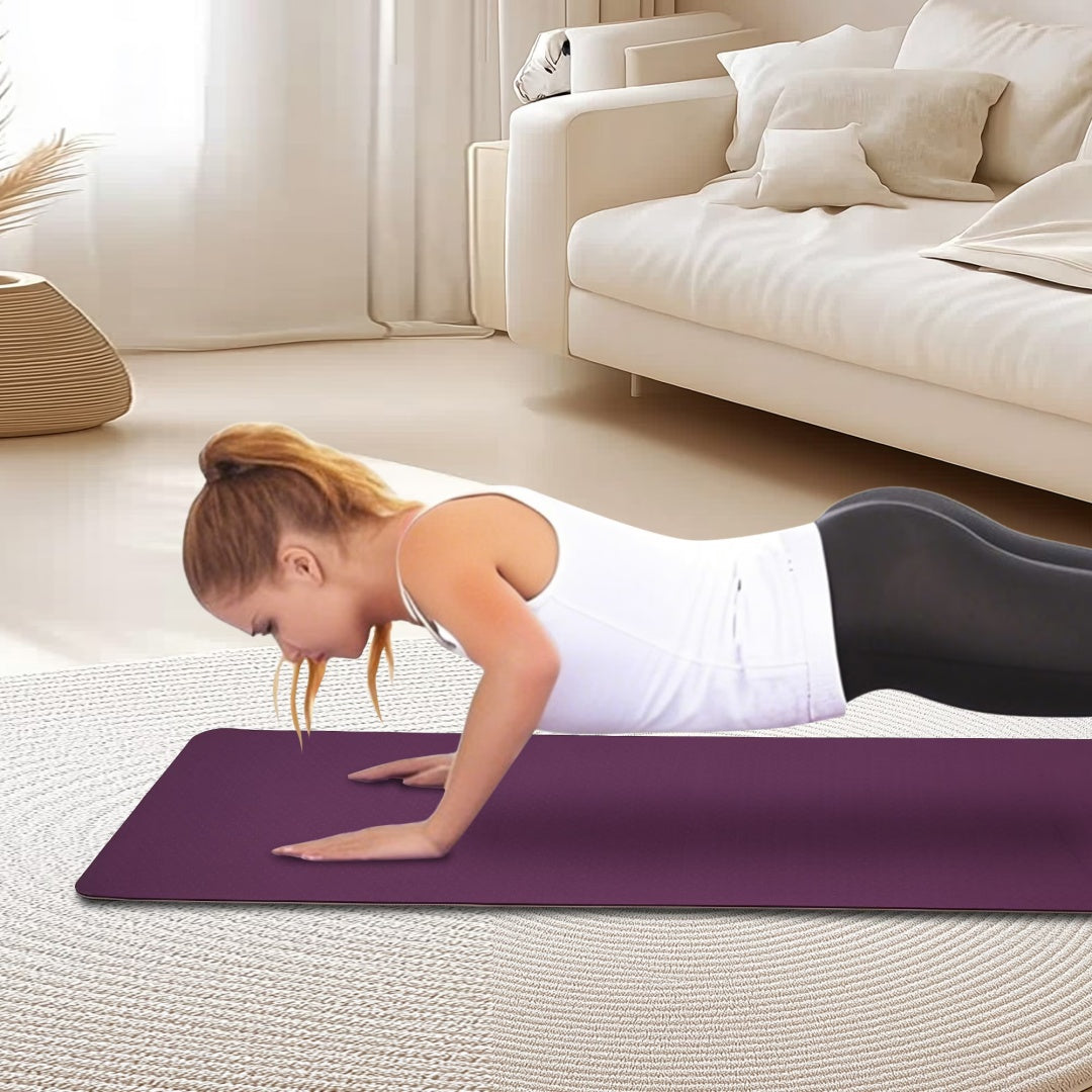 Purple yoga mat shown partially rolled
